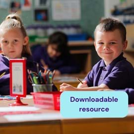 Smiling young boy and girl in purple uniforms sit at a classroom table with colourful pencils. Text overlay reads Downloadable resource.
