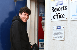 Supported Employment Client Standing Outside Workplace Smiling