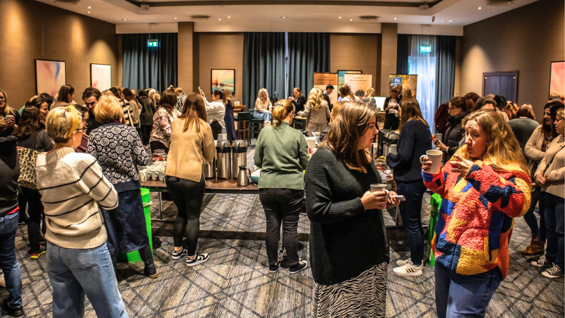 people gathered and conversing at a conference