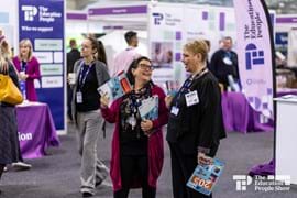 People smiling at a conference